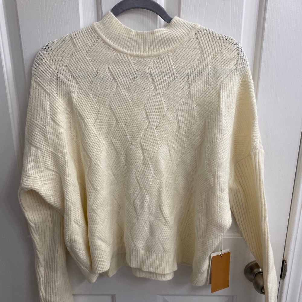 Cyrus cream colored XL sweater. NWT